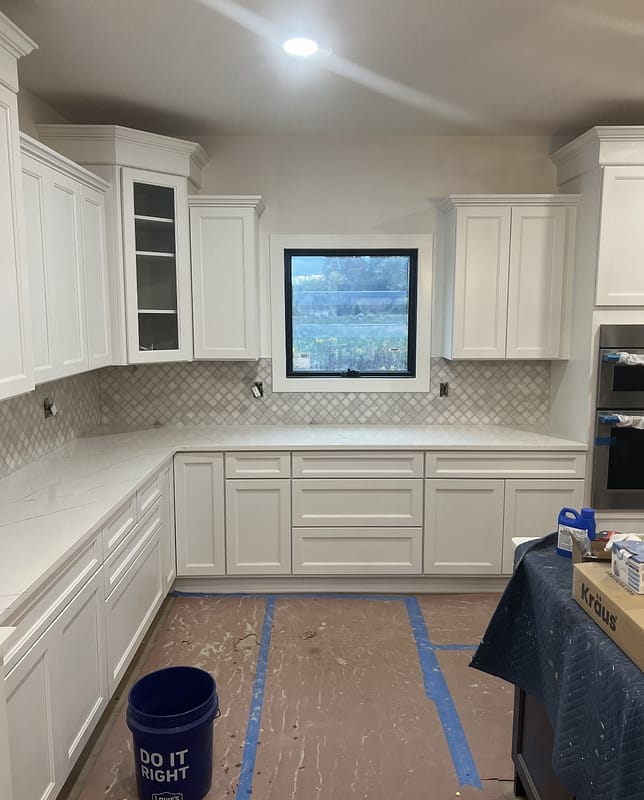 Custom kitchen remodel in Dublin Ohio showcasing tile backsplash and modern finishes