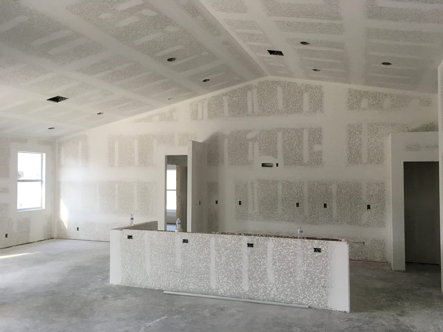 drywall installation with textured finishing