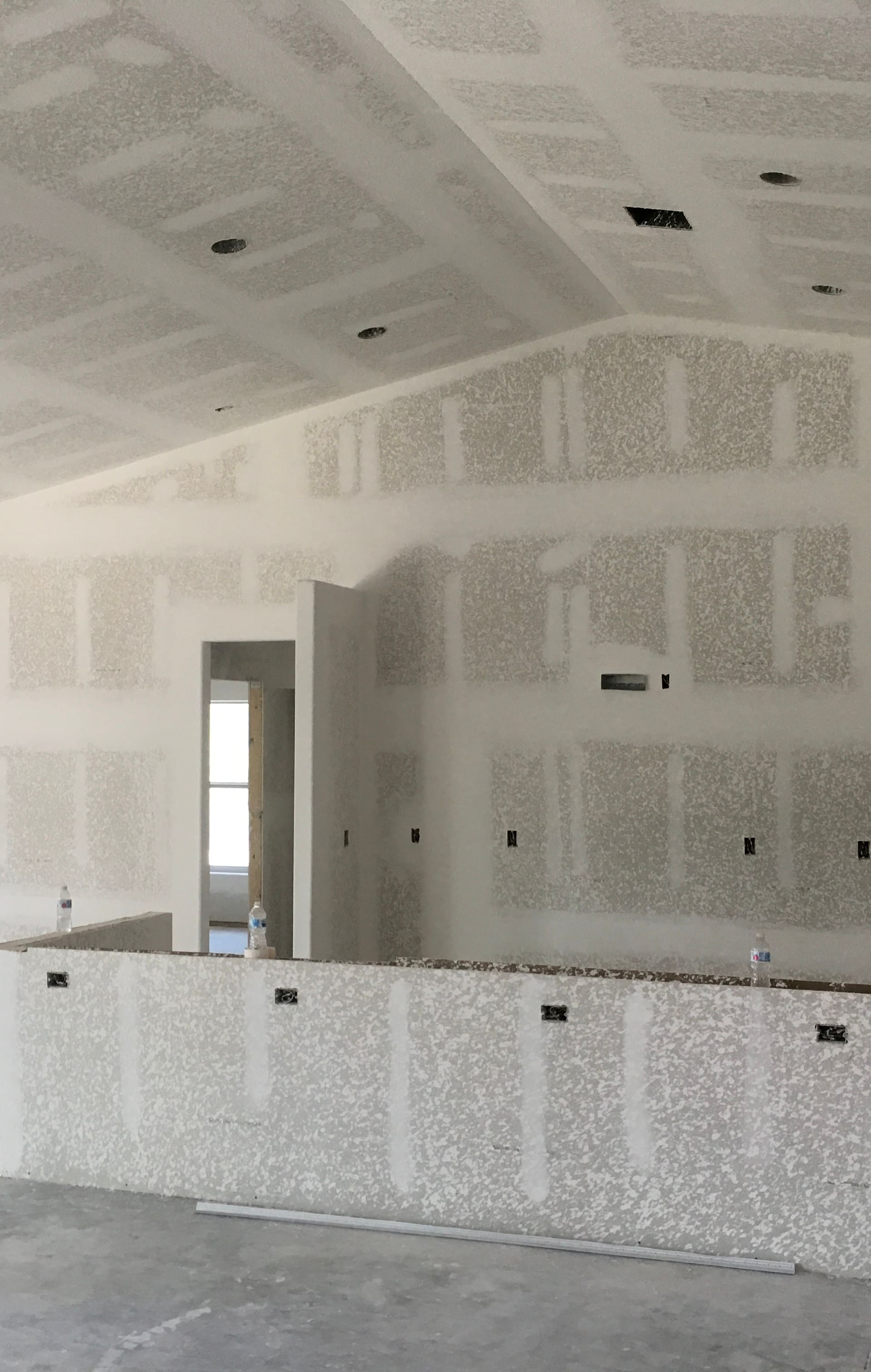 drywall installation with textured finishing